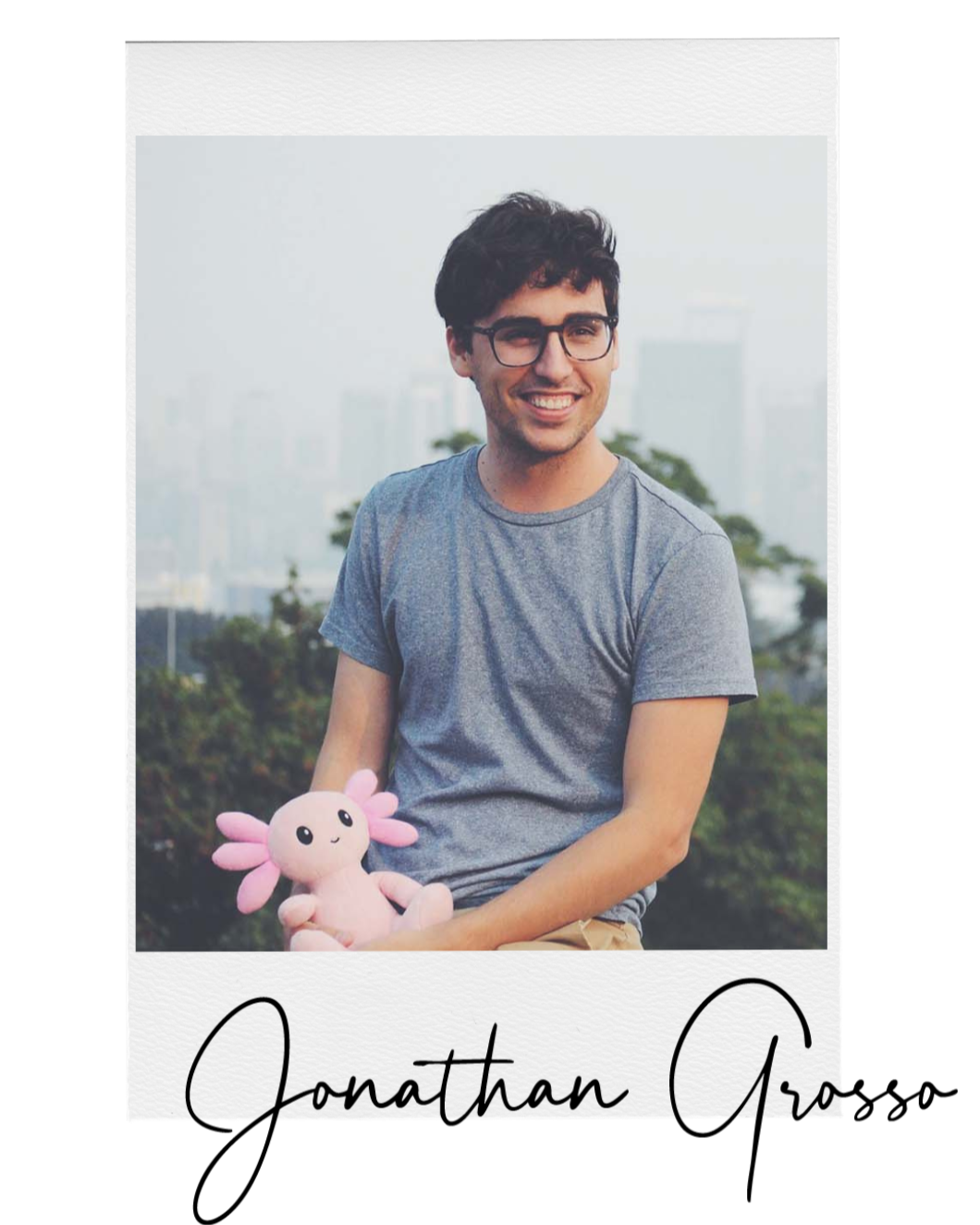 Person holding a pink axol the axolotl plush toy with 'Jonathan Grosso' text on a white background