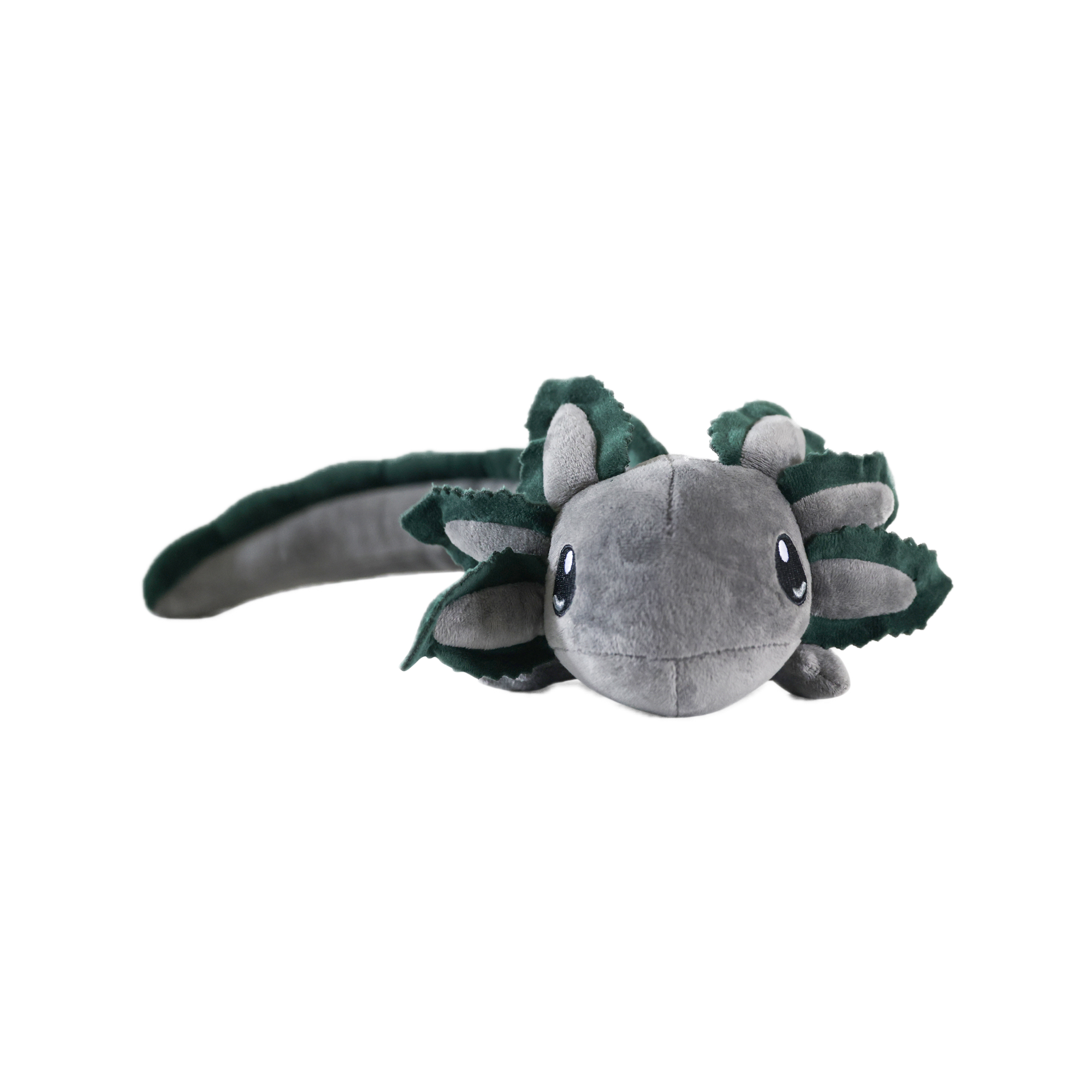 Plush toy resembling a gray axolotl with green leaf-like appendages on a white background